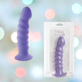 A neon purple, textured silicone dildo with a suction cup base is displayed next to its packaging against a soft, blurred background with colorful bokeh lights. The packaging reads "Maia 'Kendall' 8" Silicone Dildo.